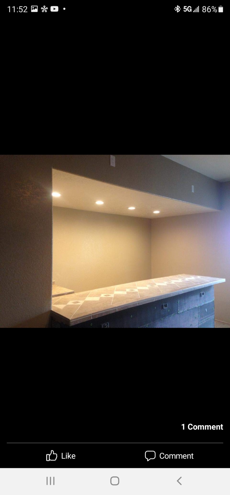 Custom tiled counter and recessed lighting in an interior project